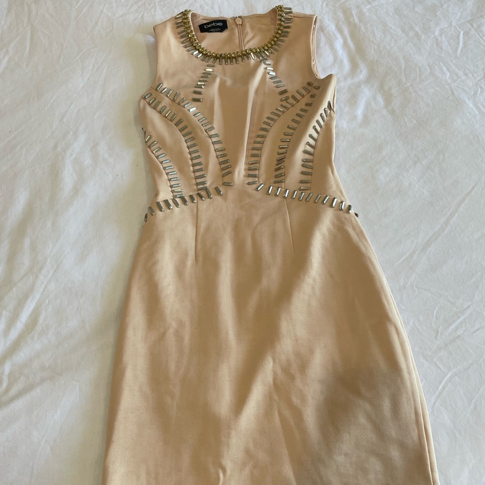 BEBE Size xxs mini dress in cream/peach color.